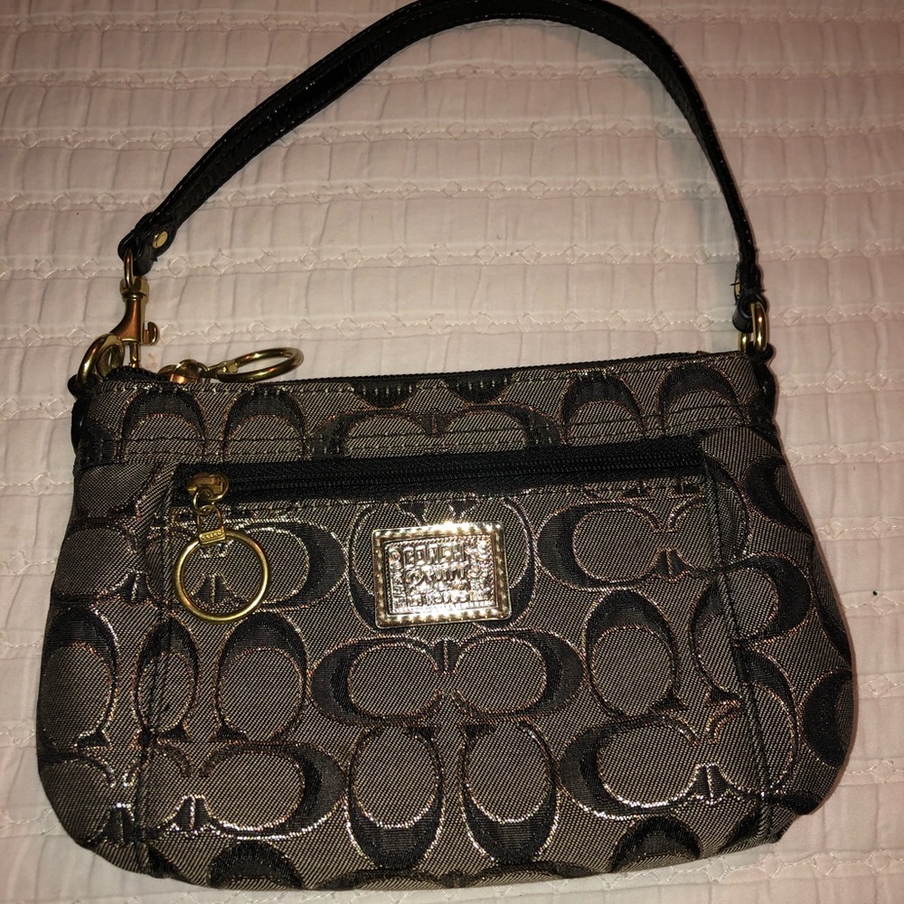 Beautiful Coach black and gold wristlet